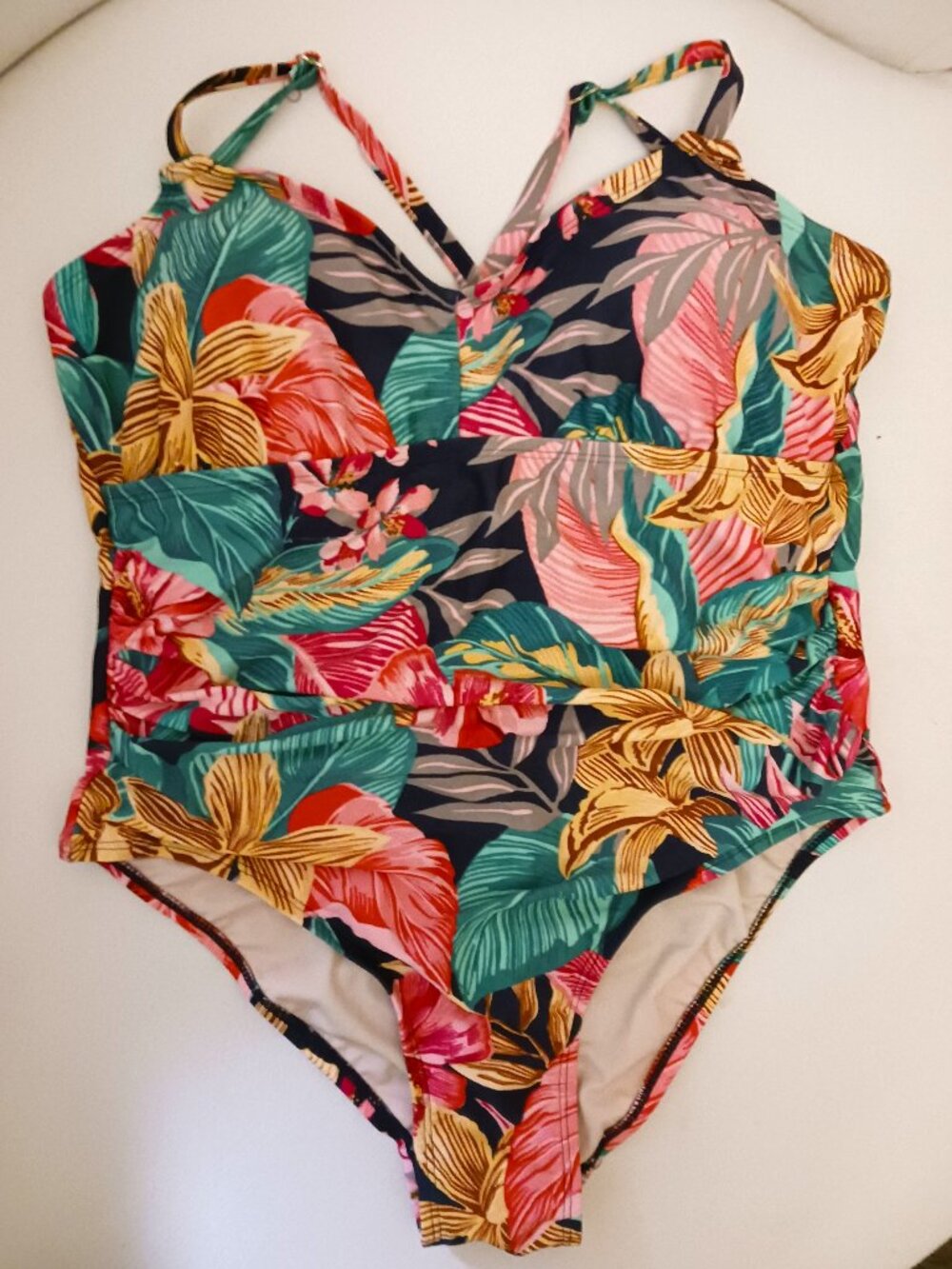 Tropical print one-piece swimsuit, with cross-over straps. Size 14